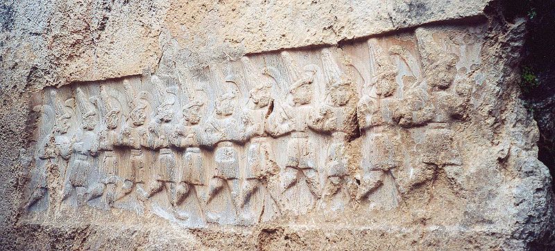 image Procession of 12 Hittite Warrior gods, rock relief at Yazilikaya photo © China Crisis Wikimedia Commons